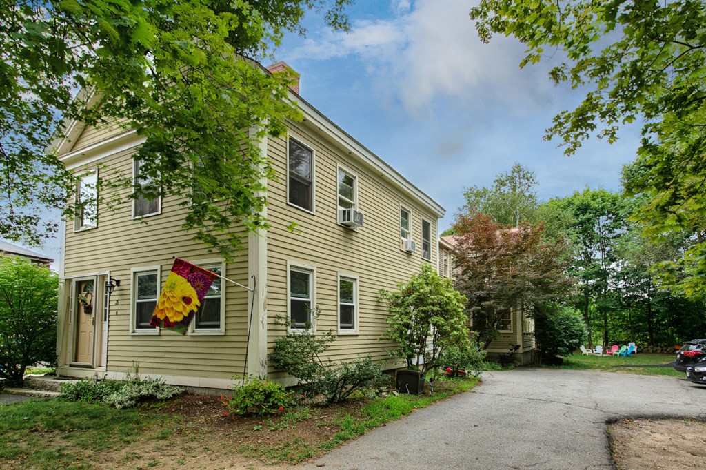 27 Andover Road, Unit 2 Billerica, MA 01821 - Photo 4 of 23 a view of a house with a yard