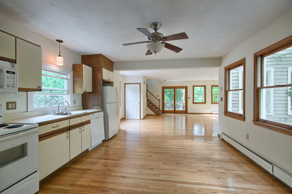 27 Andover Road, Unit 2 Billerica, MA 01821 - Photo 6 of 23 a view of a kitchen with a sink wooden floor and windows