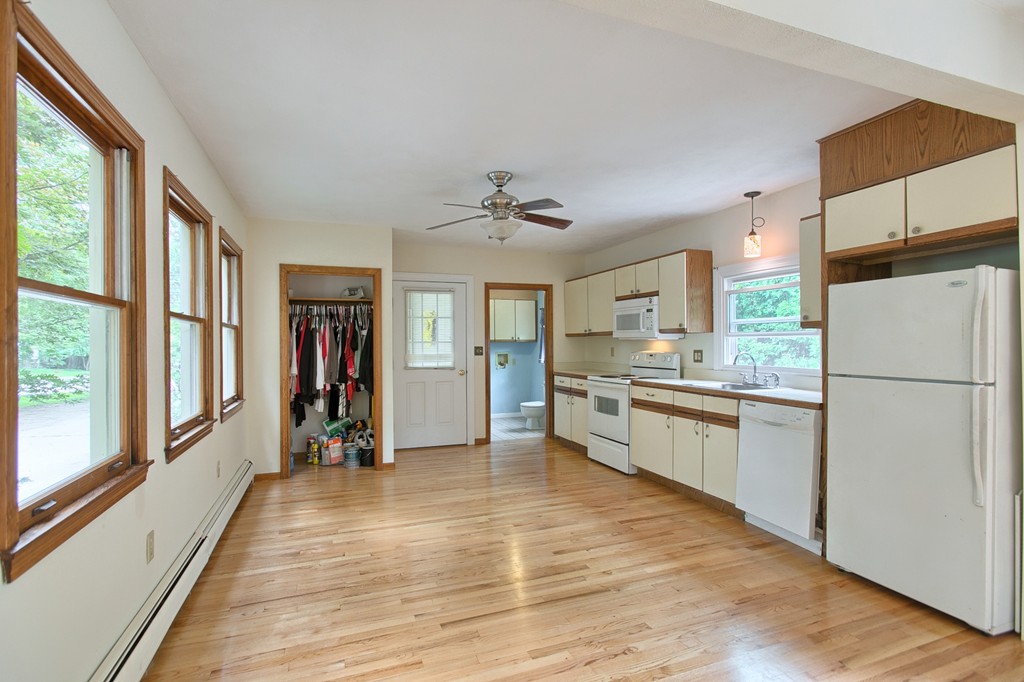 27 Andover Road, Unit 2 Billerica, MA 01821 - Photo 7 of 23 a kitchen with stainless steel appliances granite countertop a refrigerator and a sink