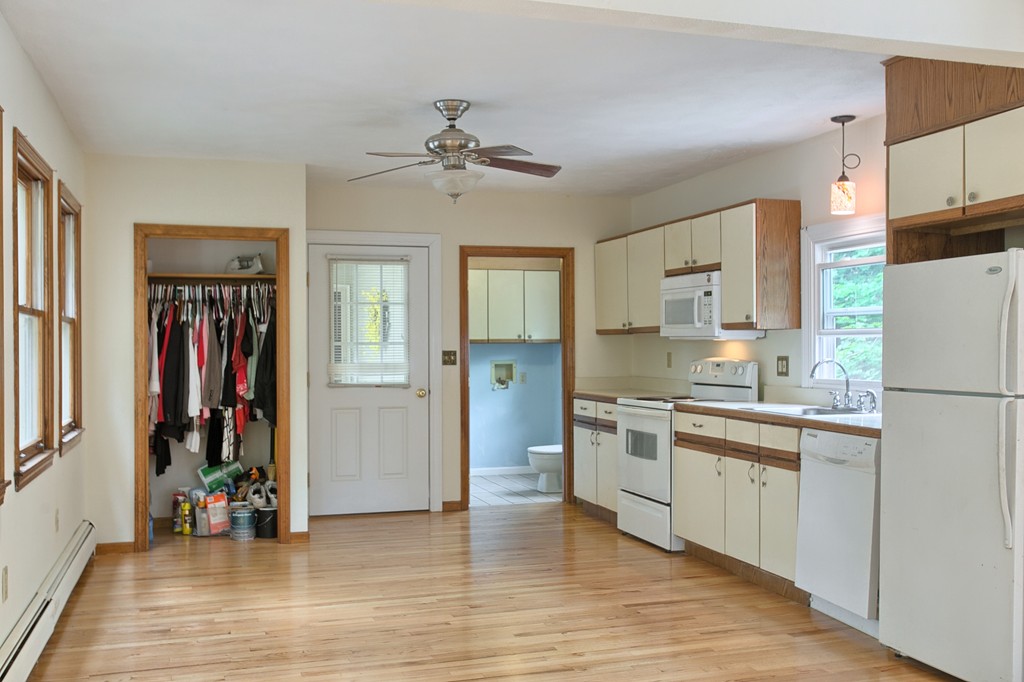 27 Andover Road, Unit 2 Billerica, MA 01821 - Photo 8 of 23 a kitchen with stainless steel appliances granite countertop a refrigerator and a sink