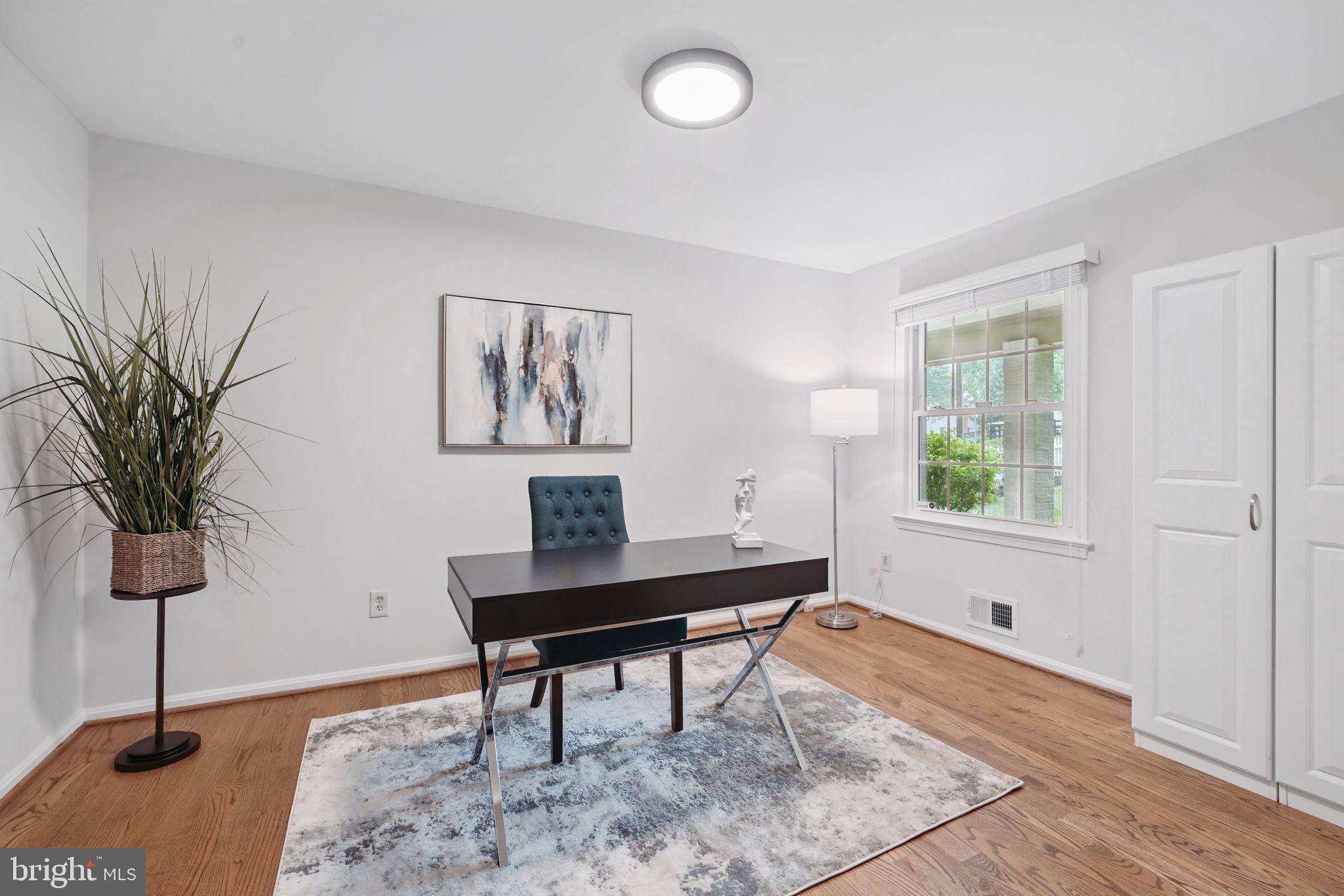 11340 Waples Mill Road Oakton, VA 22124 - Photo 14 of 34 a view of a workspace with furniture and a window