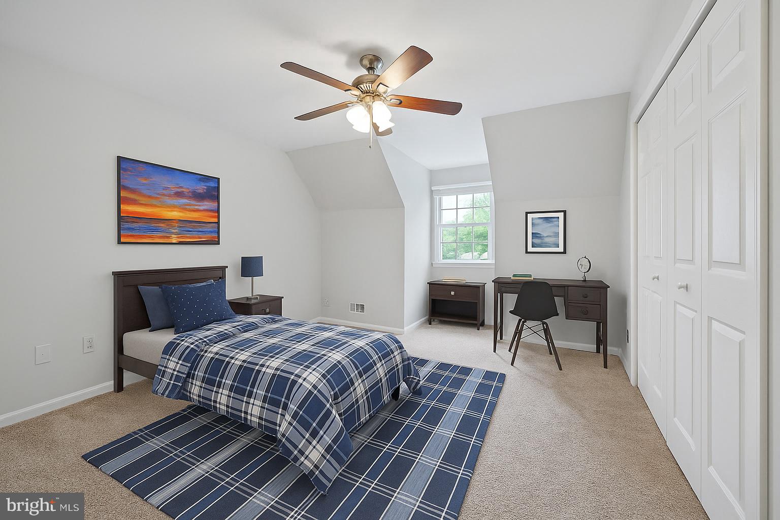 11340 Waples Mill Road Oakton, VA 22124 - Photo 16 of 34 a bedroom with a bed and a table in it