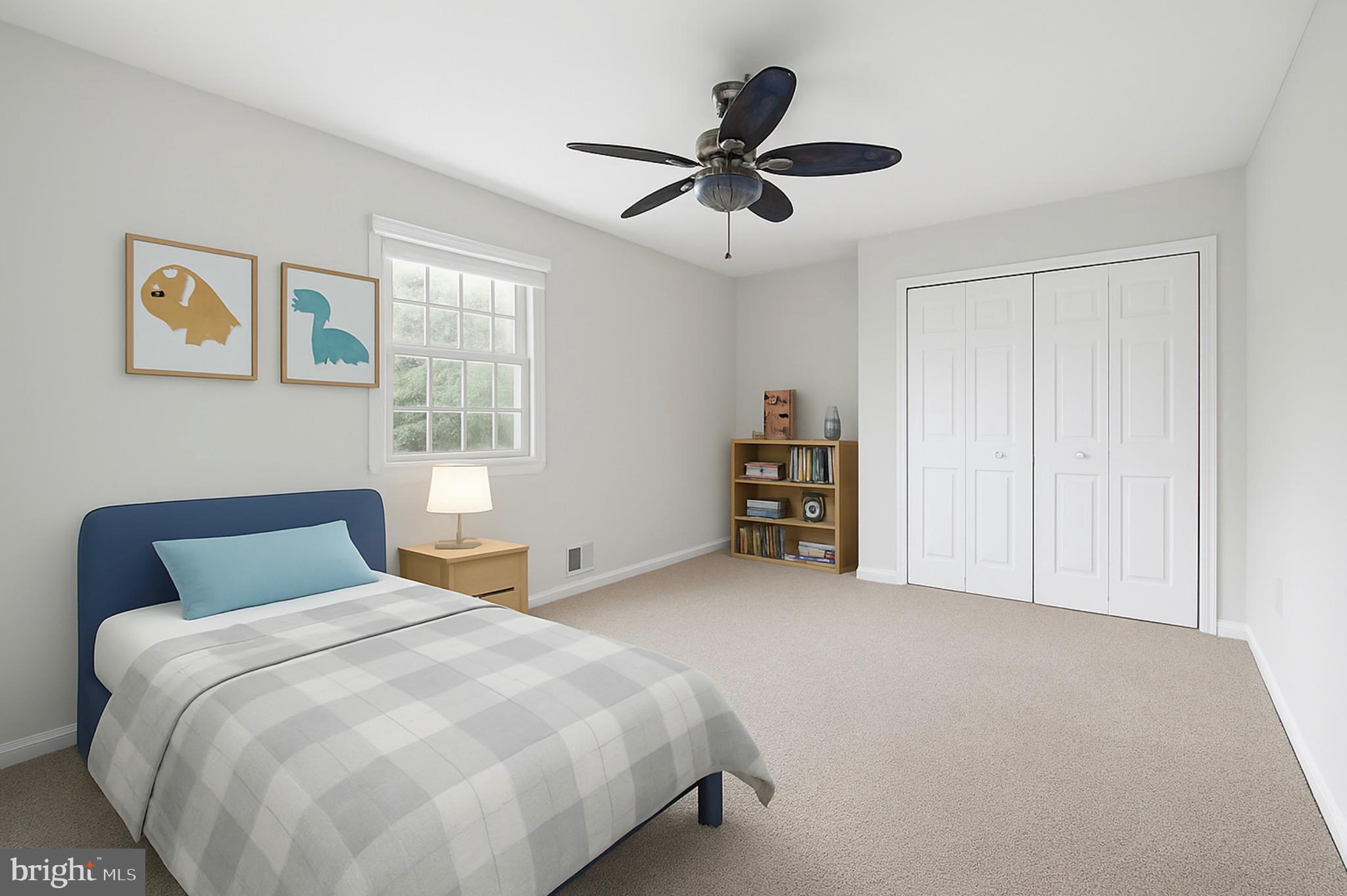 11340 Waples Mill Road Oakton, VA 22124 - Photo 17 of 34 a bedroom with a bed and a ceiling fan