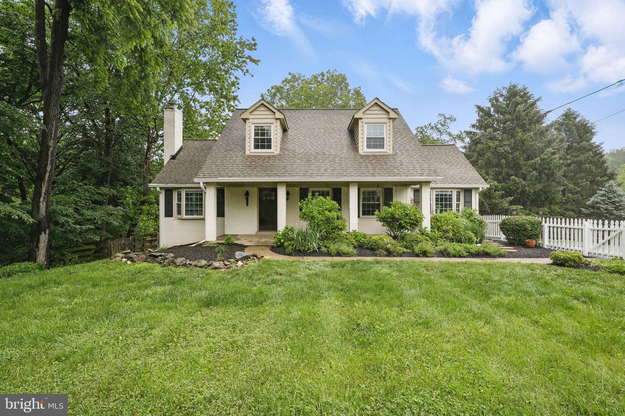 11340 Waples Mill Road Oakton, VA 22124 - Photo 2 of 34 a front view of a house with a yard