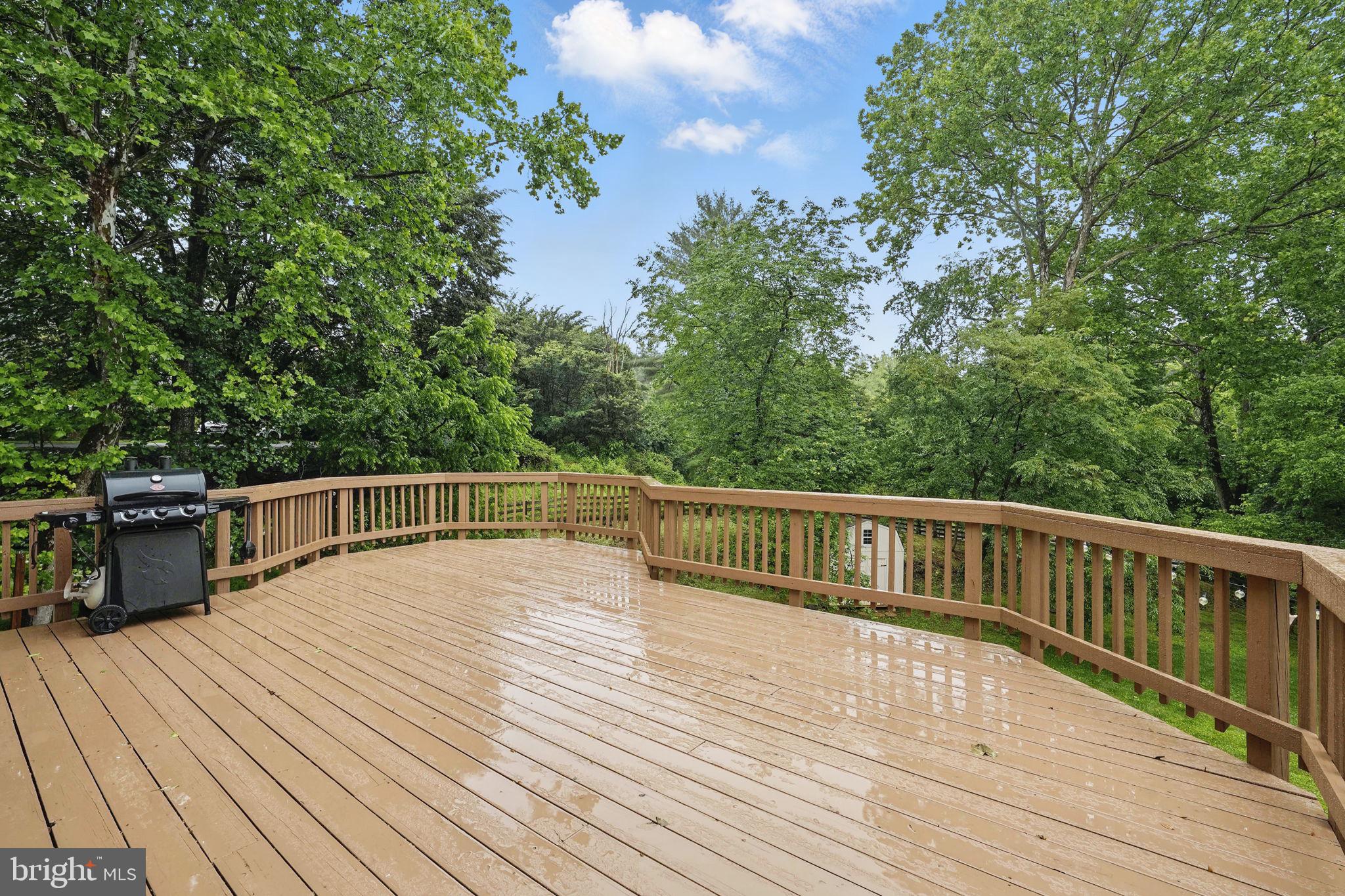 11340 Waples Mill Road Oakton, VA 22124 - Photo 22 of 34 a balcony with wooden floor and fence