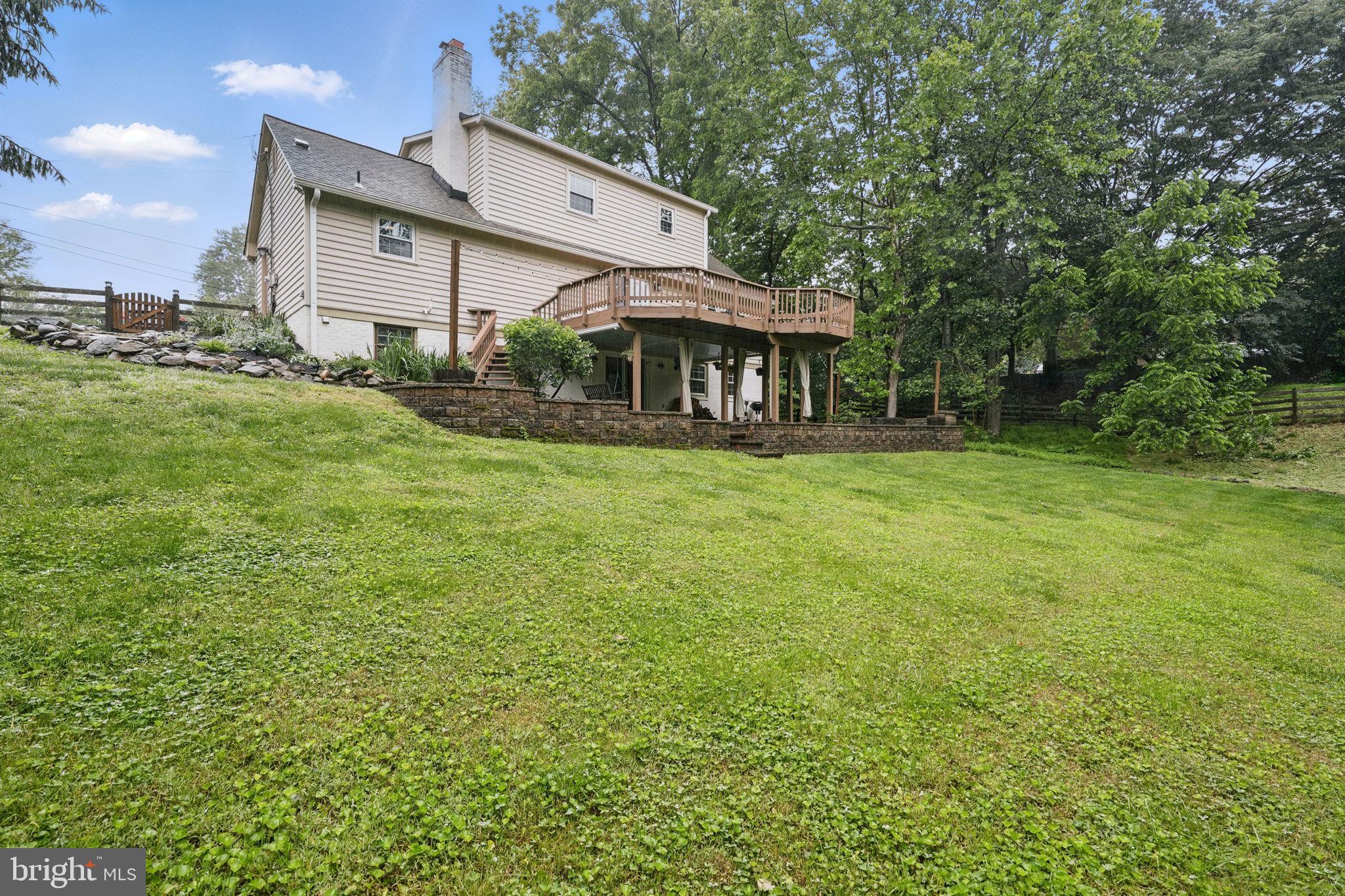 11340 Waples Mill Road Oakton, VA 22124 - Photo 29 of 34 a front view of a house with garden