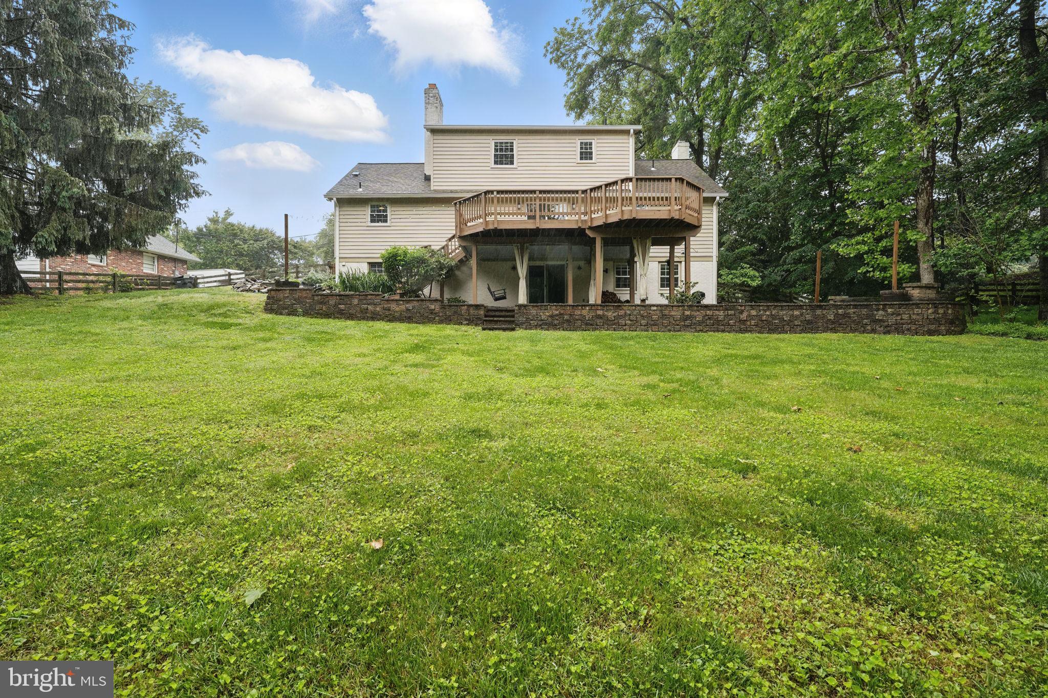 11340 Waples Mill Road Oakton, VA 22124 - Photo 30 of 34 a front view of a house with a garden