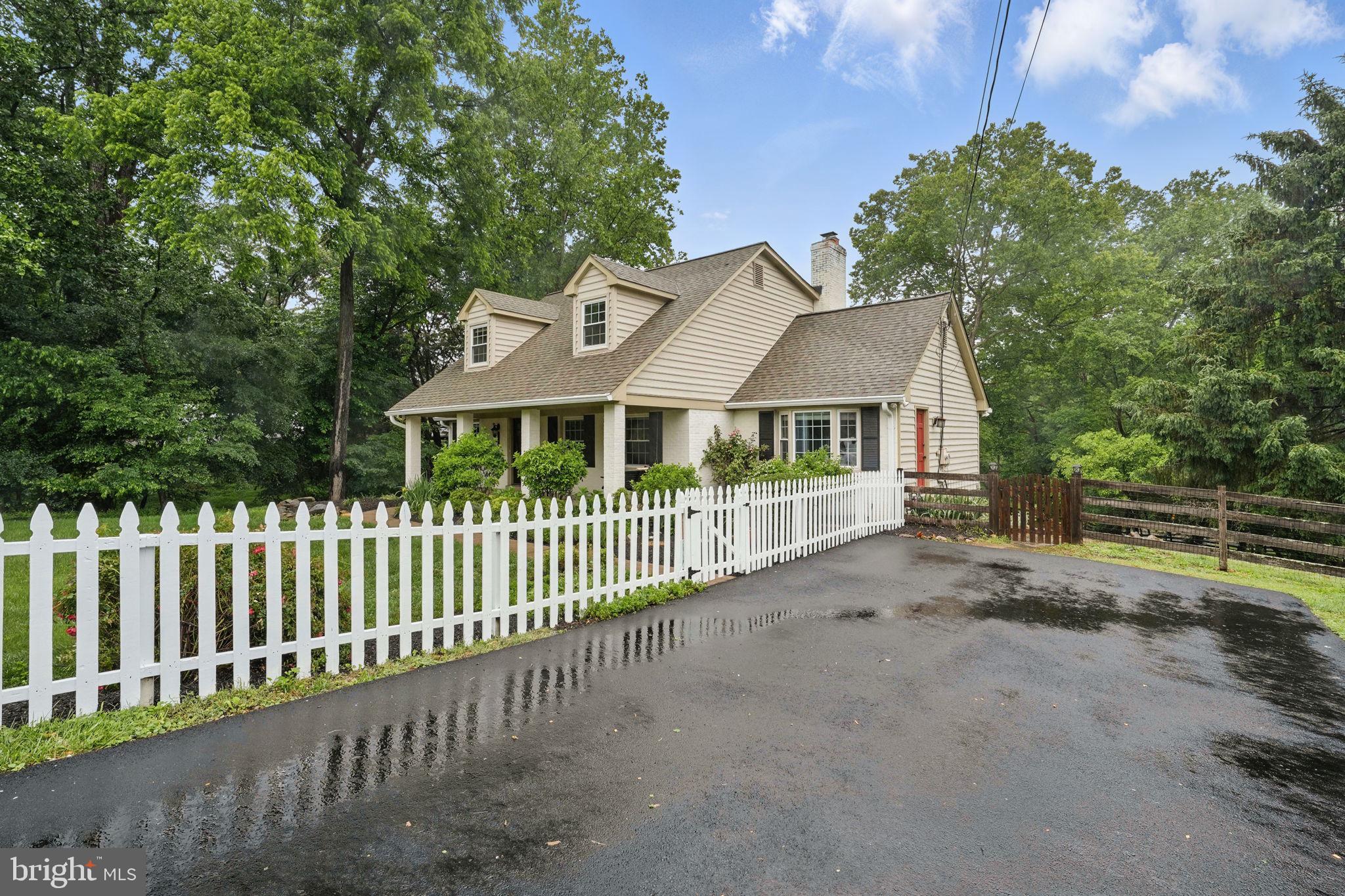 11340 Waples Mill Road Oakton, VA 22124 - Photo 3 of 34 a front view of a house with a garden