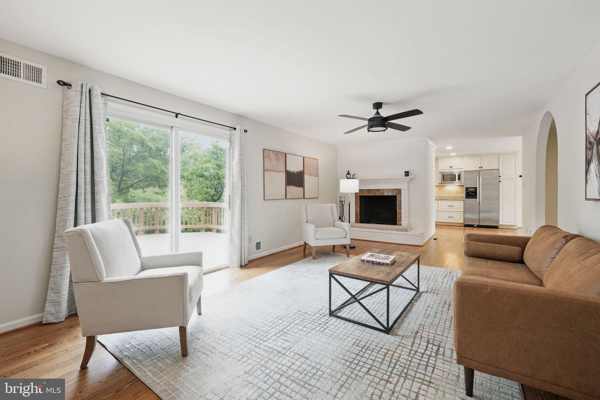 11340 Waples Mill Road Oakton, VA 22124 - Photo 5 of 34 a living room with furniture and a fireplace
