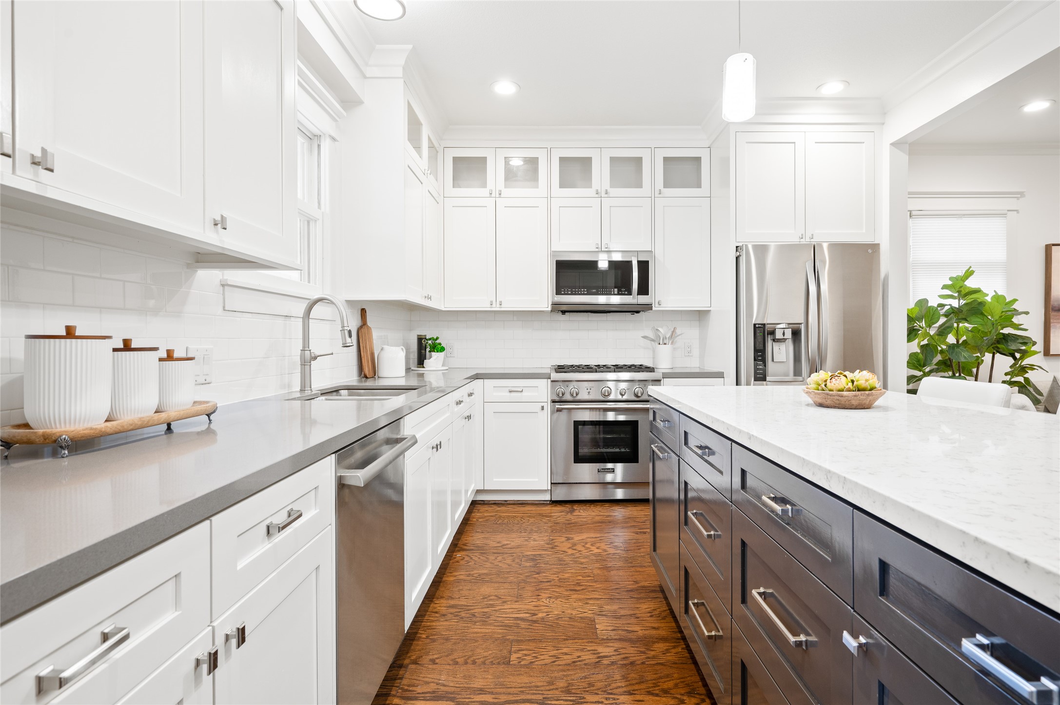 714 Wilken Street Houston, TX 77008 - Photo 12 of 35 a kitchen with kitchen island granite countertop a sink stainless steel appliances and cabinets