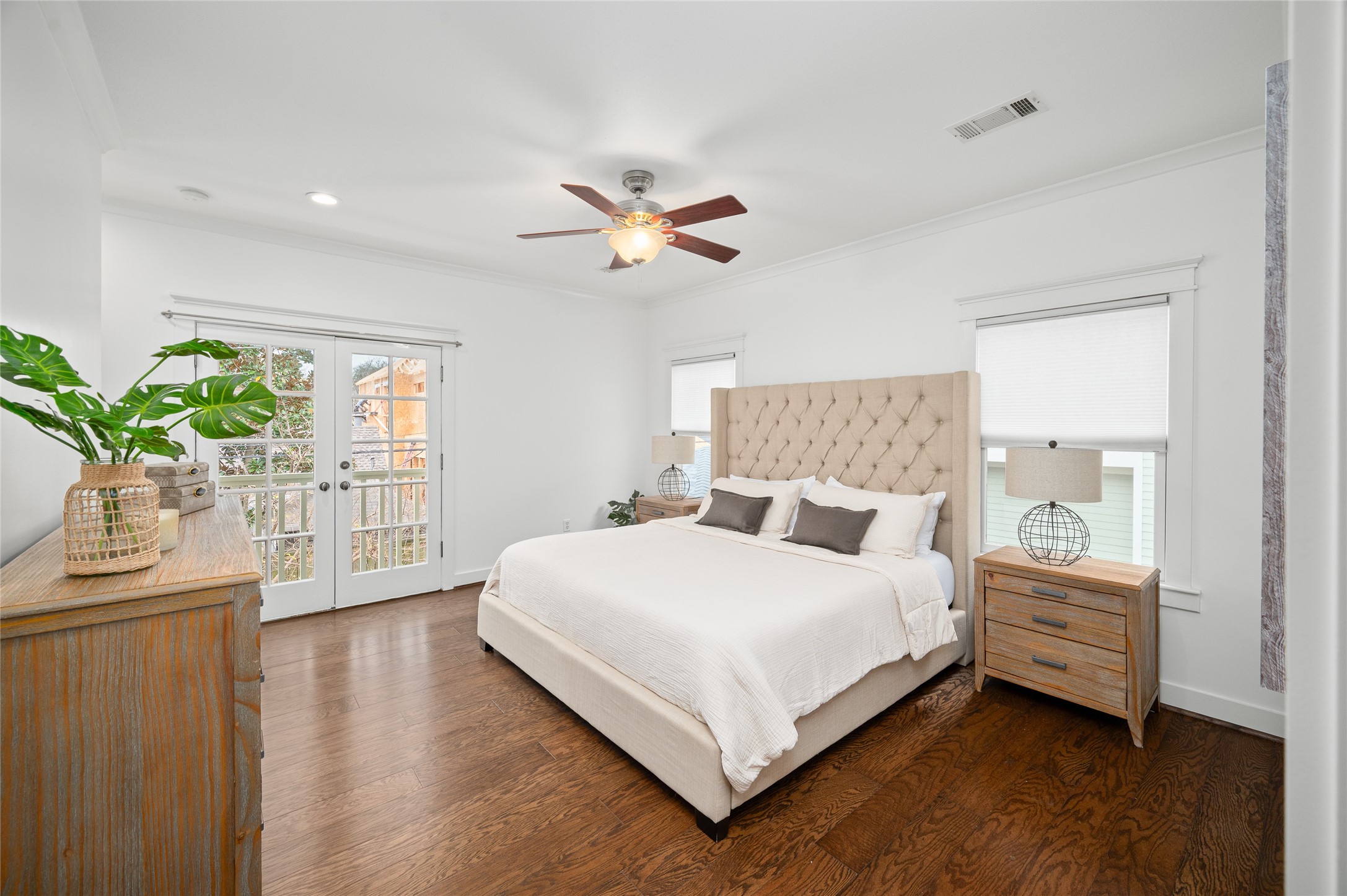 714 Wilken Street Houston, TX 77008 - Photo 18 of 35 a bedroom with a bed chandelier and a window