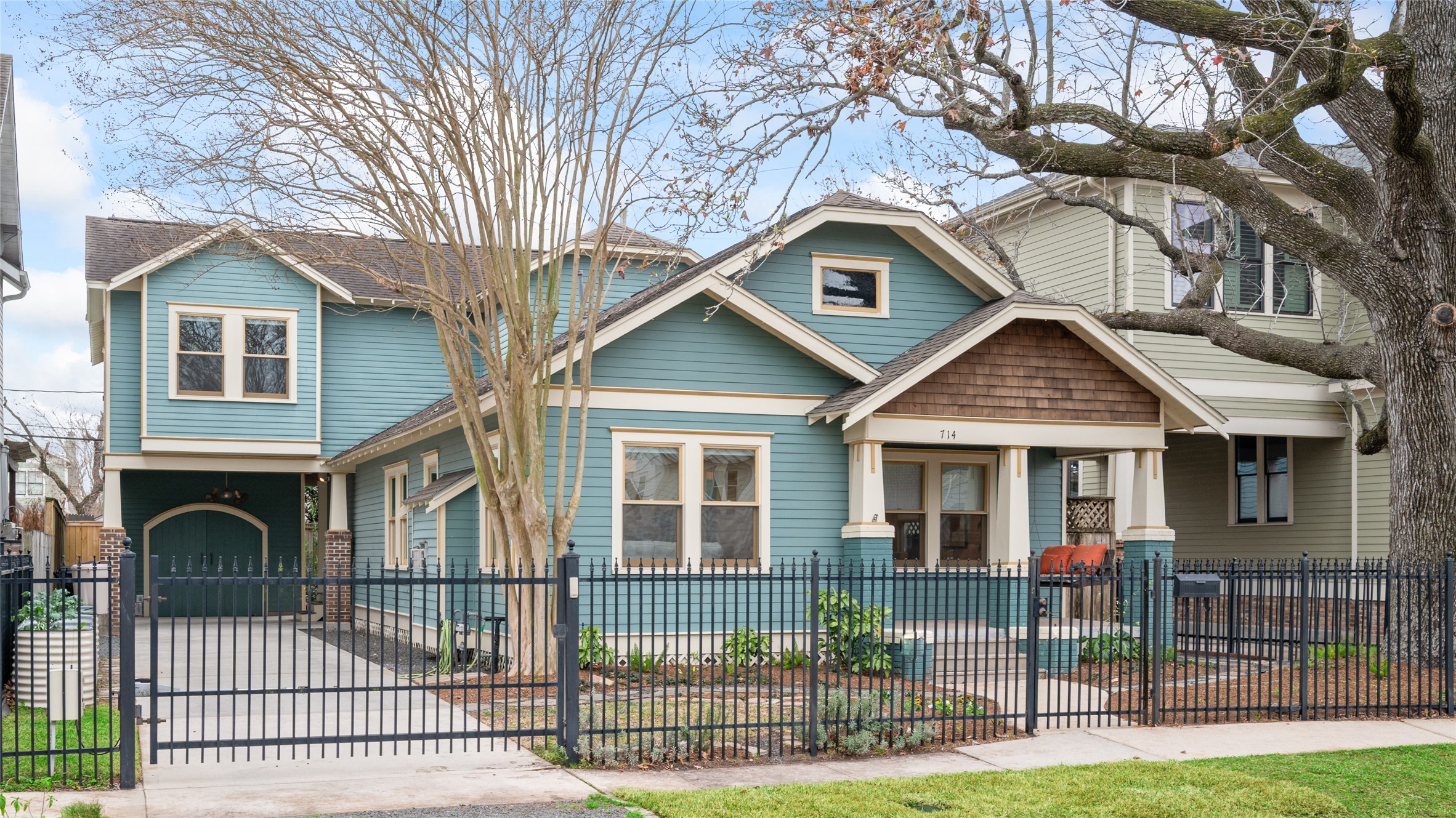 714 Wilken Street Houston, TX 77008 - Photo 2 of 35 a front view of a house with glass windows and yard