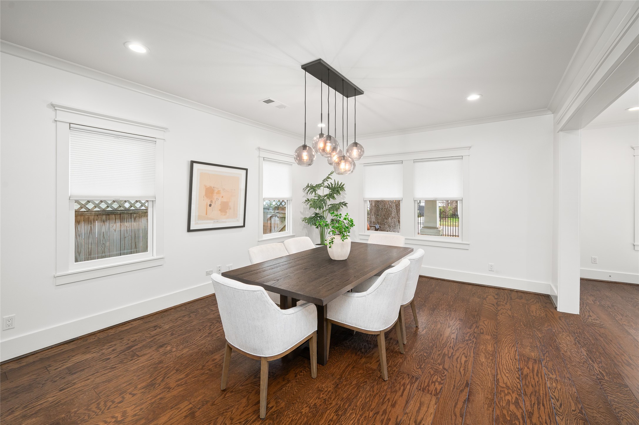 714 Wilken Street Houston, TX 77008 - Photo 7 of 35 a view of a dining room with furniture wooden floor and chandelier