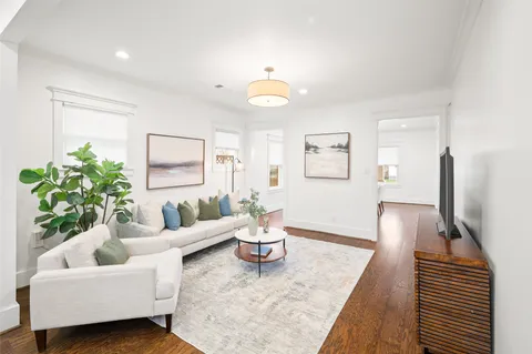 a living room with furniture and a table
