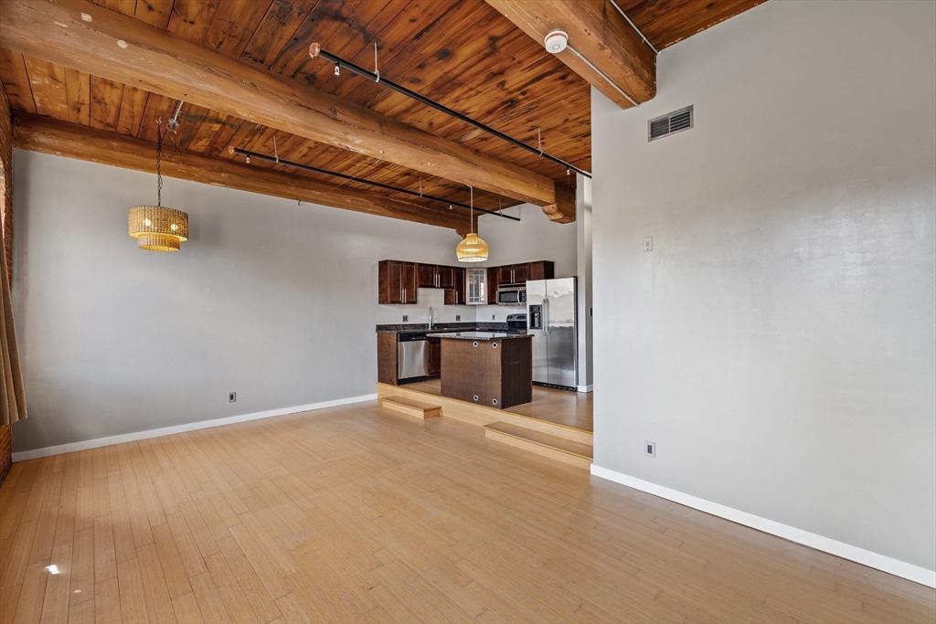 1511 Main Street, Unit C306 Worcester, MA 01603 - Photo 15 of 33 a view of kitchen with refrigerator and stove