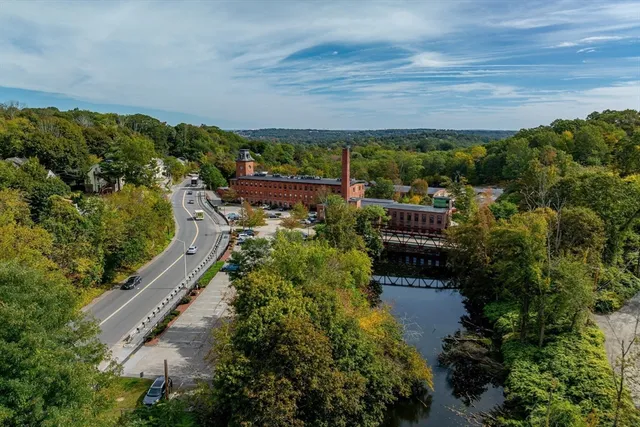 a aerial view of a house with a yard