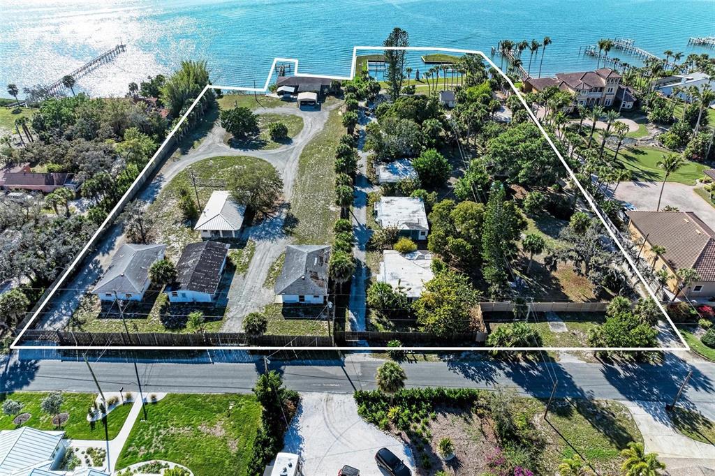 1645 Bayshore Road Nokomis, FL 34275 - Photo 11 of 19 an aerial view of a house with a garden and outdoor space