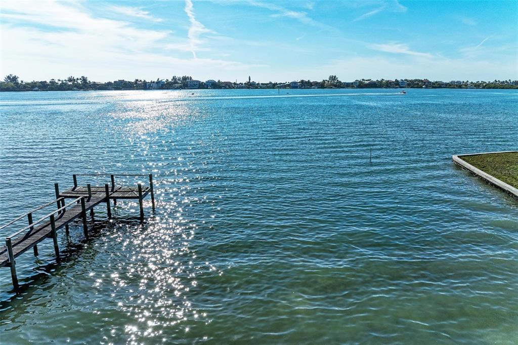 1645 Bayshore Road Nokomis, FL 34275 - Photo 17 of 19 a view of a lake with outdoor seating