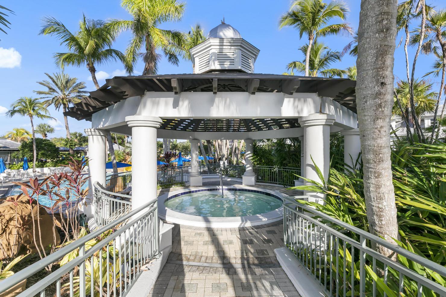 9213 Museo Circle, Unit 103 Naples, FL 34114 - Photo 43 of 47 swimming pool view with seating space