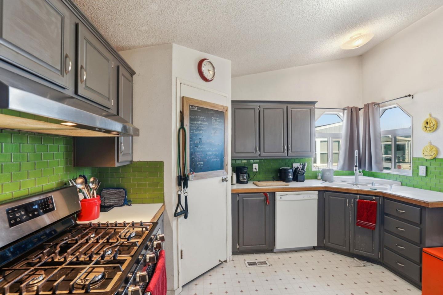 20 Russell Road, Unit 8 Salinas, CA 93906 - Photo 9 of 38 a kitchen with a sink stove and cabinets