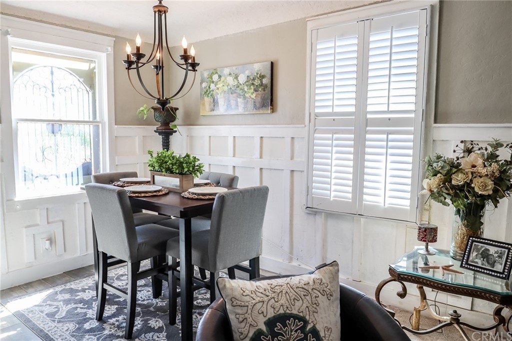 304 C Street Needles, CA 92363 - Photo 12 of 57 a dining room with furniture a chandelier and wooden floor