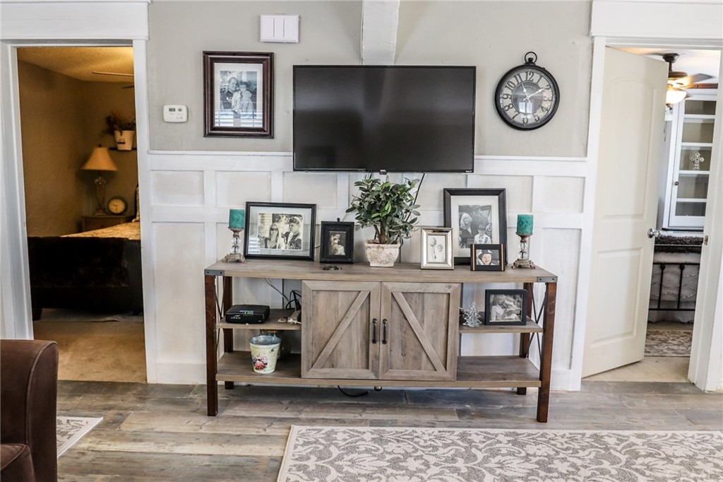 304 C Street Needles, CA 92363 - Photo 18 of 57 a living room with fireplace furniture and a flat screen tv