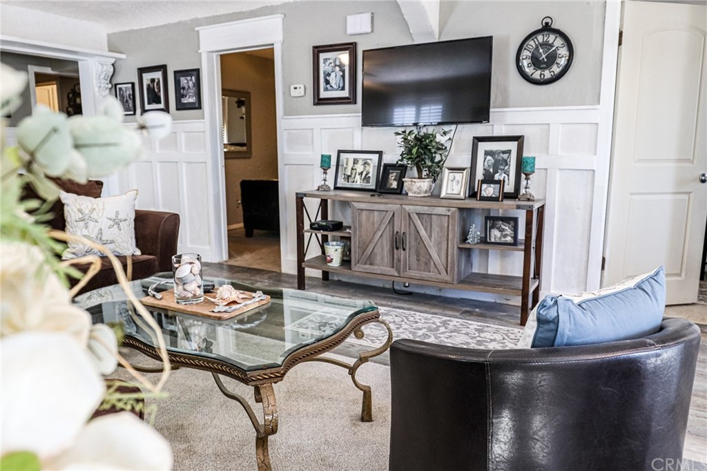 304 C Street Needles, CA 92363 - Photo 24 of 57 a living room with fireplace furniture and a flat screen tv