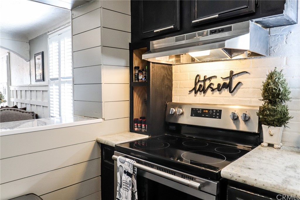 304 C Street Needles, CA 92363 - Photo 30 of 57 a stove top oven sitting inside of a kitchen