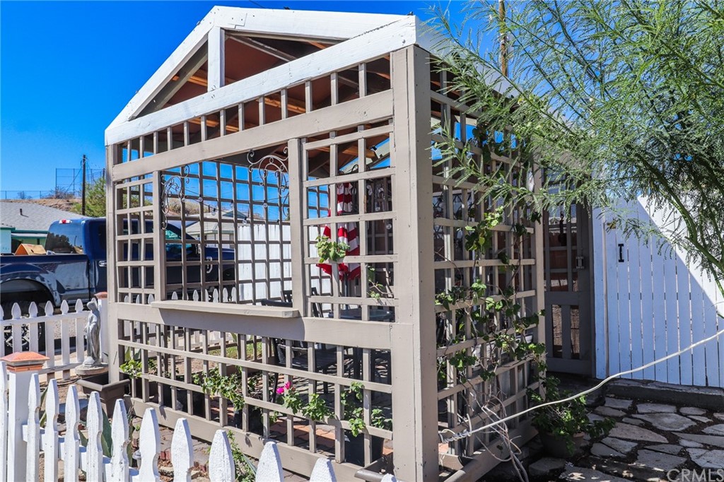 304 C Street Needles, CA 92363 - Photo 4 of 57 a front view of a building with glass windows and plants