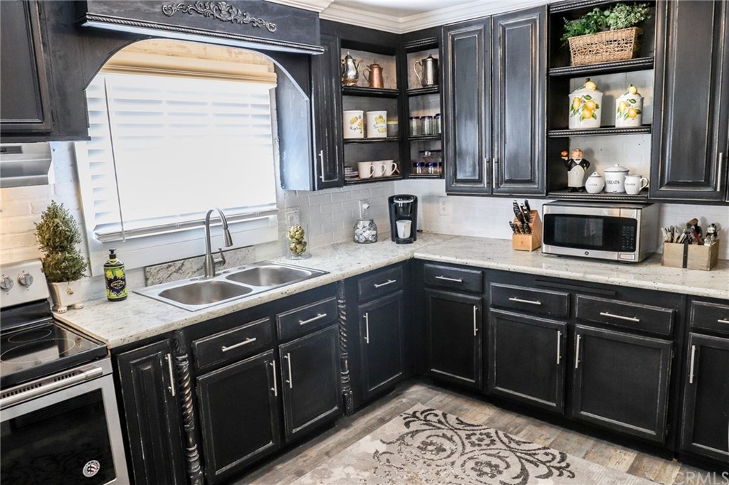 304 C Street Needles, CA 92363 - Photo 32 of 57 a kitchen with a sink and a window