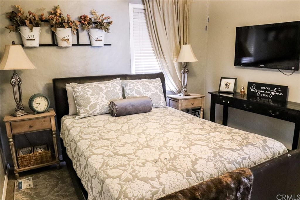 304 C Street Needles, CA 92363 - Photo 38 of 57 a bedroom with a bed and a flat screen tv