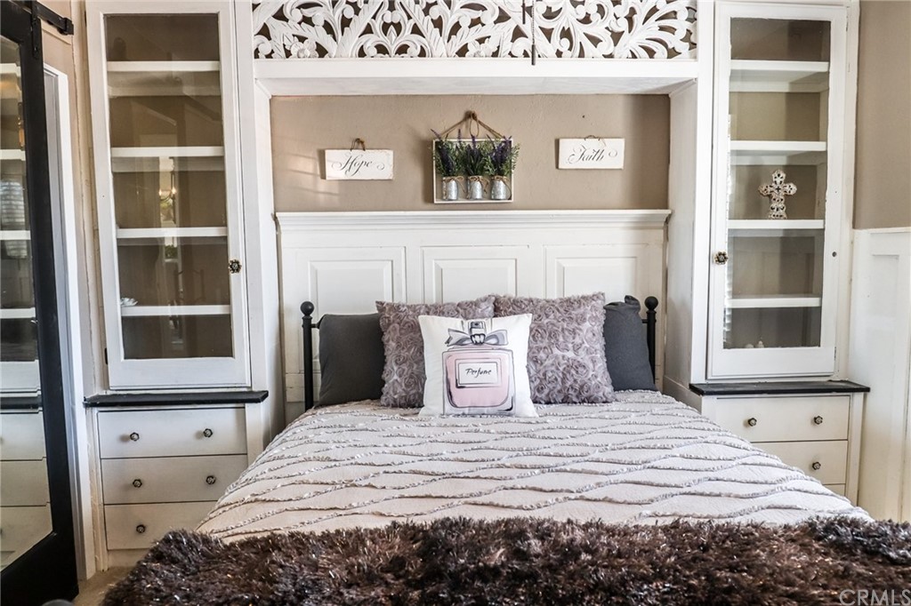 304 C Street Needles, CA 92363 - Photo 41 of 57 a large bed sitting in a bedroom next to a window