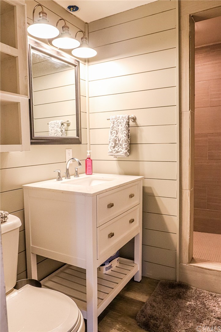 304 C Street Needles, CA 92363 - Photo 45 of 57 a bathroom with a sink toilet vanity and tub