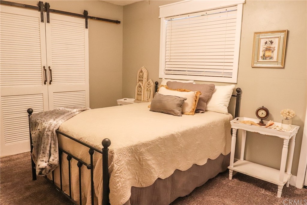 304 C Street Needles, CA 92363 - Photo 48 of 57 a bedroom with a bed and a table