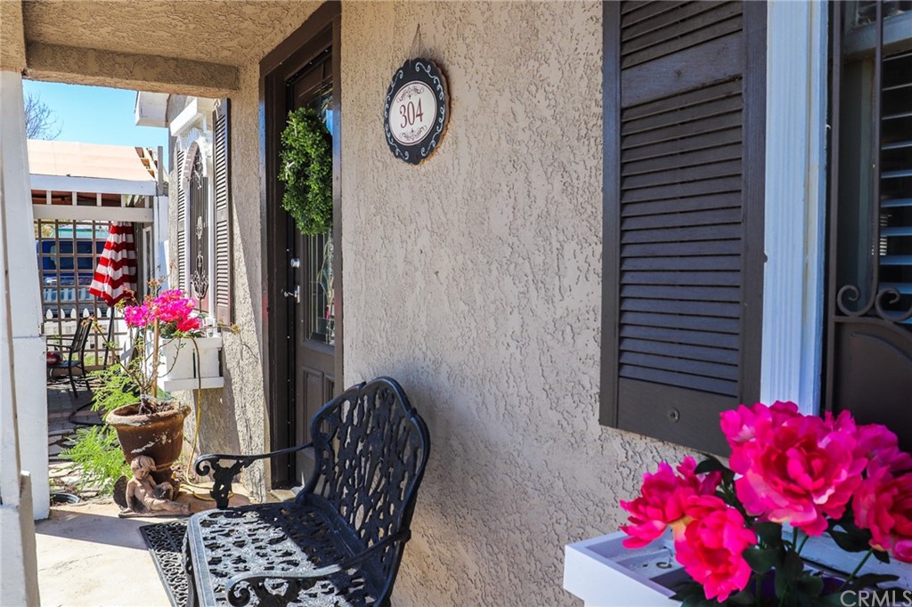 304 C Street Needles, CA 92363 - Photo 6 of 57 a bedroom with a bed and a chandelier