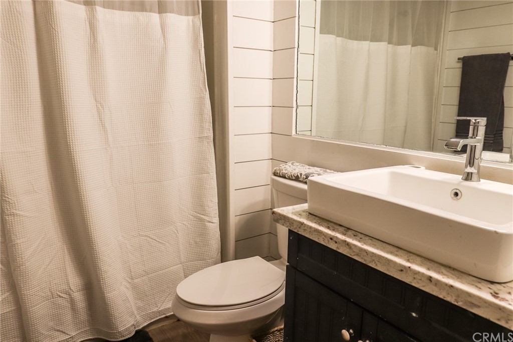 304 C Street Needles, CA 92363 - Photo 52 of 57 a bathroom with a sink and a toilet