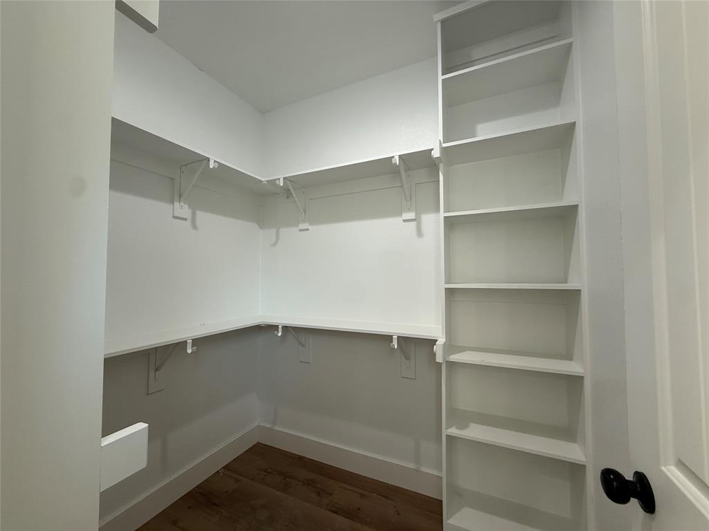 5803 Plum Dale Road Dallas, TX 75241 - Photo 13 of 14 a view of an empty walk in closet