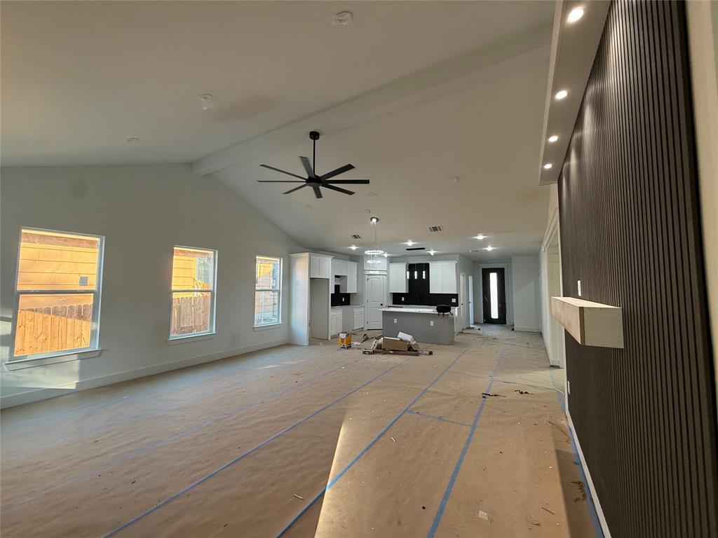5803 Plum Dale Road Dallas, TX 75241 - Photo 4 of 14 a view of a livingroom with a furniture a ceiling fan and window