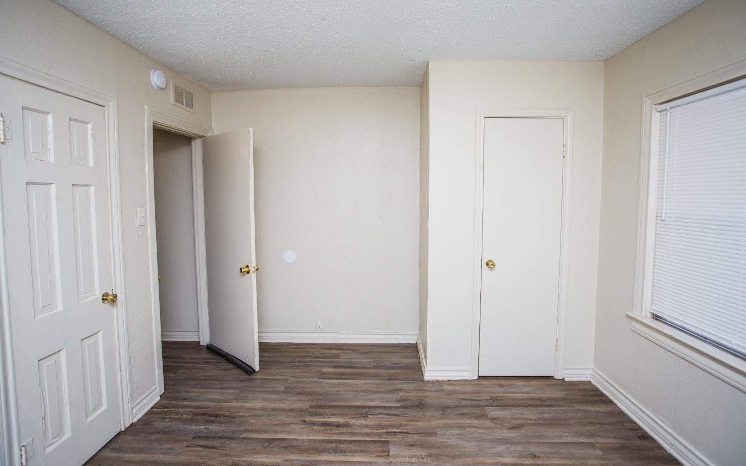 2103 22nd Street Lubbock, TX 79411 - Photo 14 of 18 a view of a hallway with wooden floor