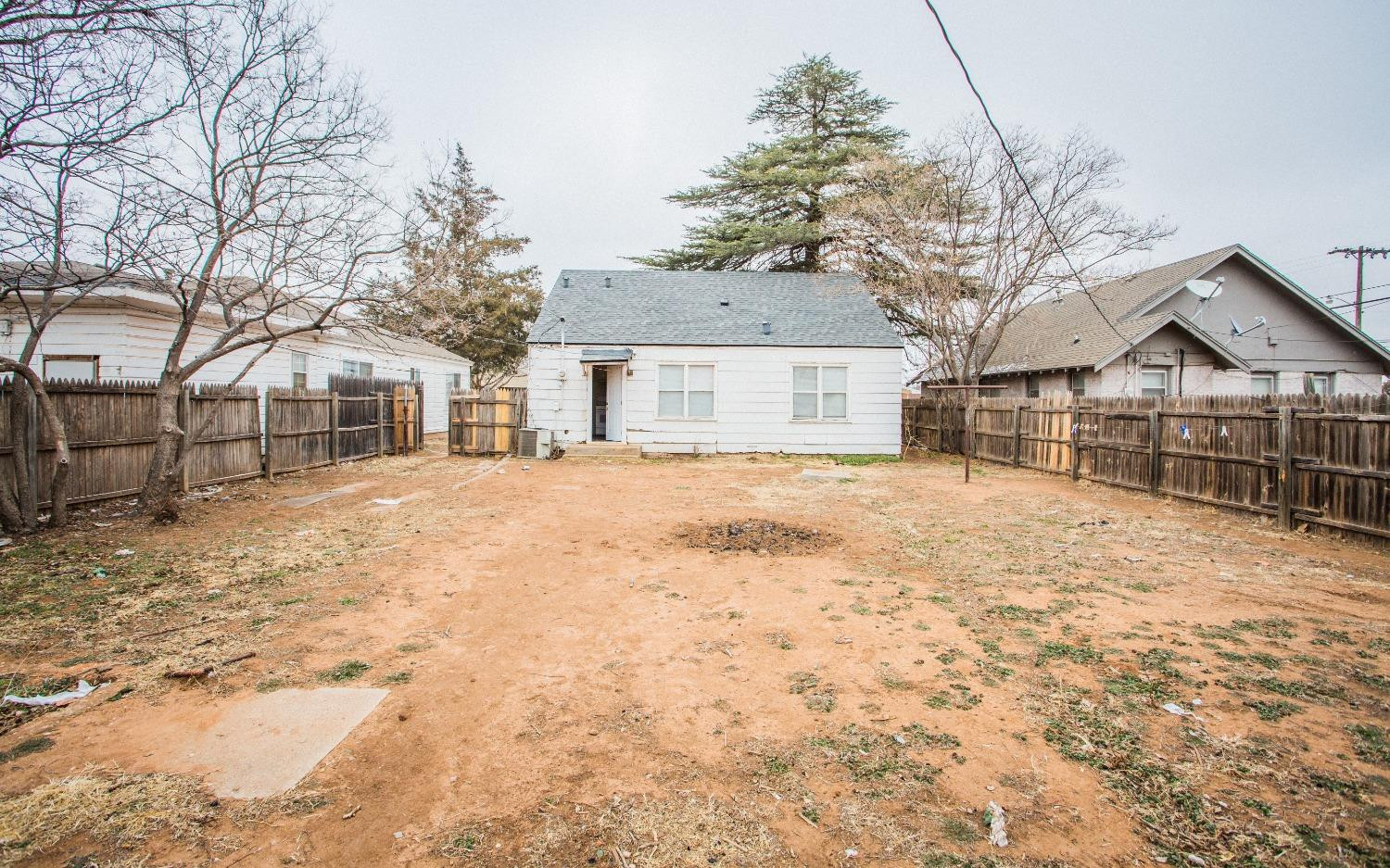 2103 22nd Street Lubbock, TX 79411 - Photo 17 of 18 a view of a yard covered with snow in front of house