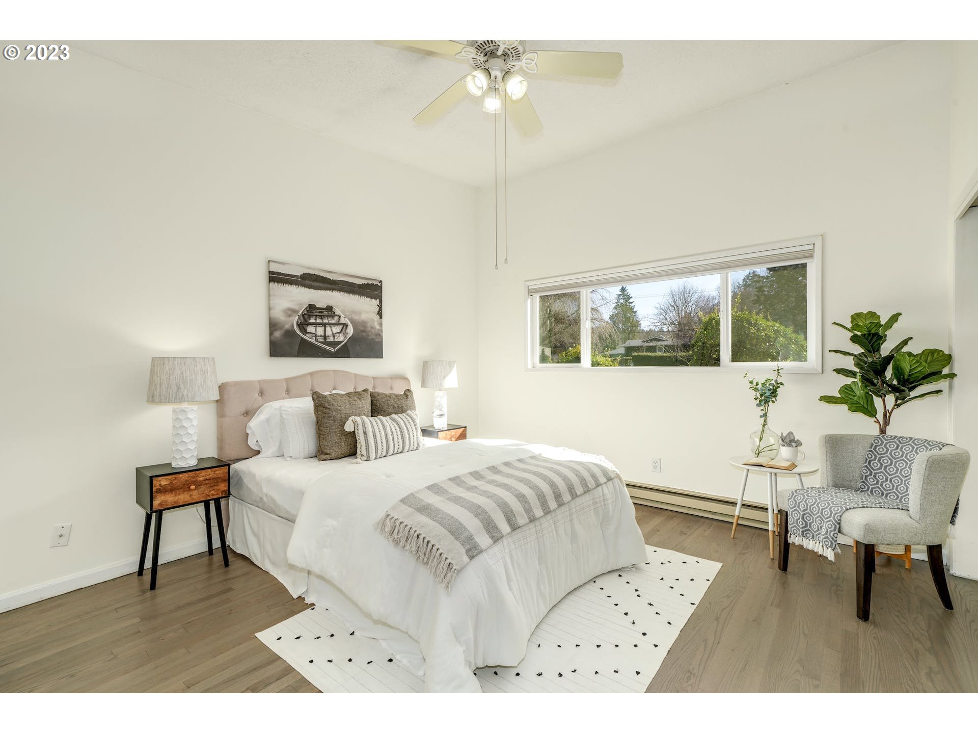 5225 Southwest Oleson Road, Unit 10 Portland, OR 97225 - Photo 15 of 30 a bedroom with a bed a table and chair