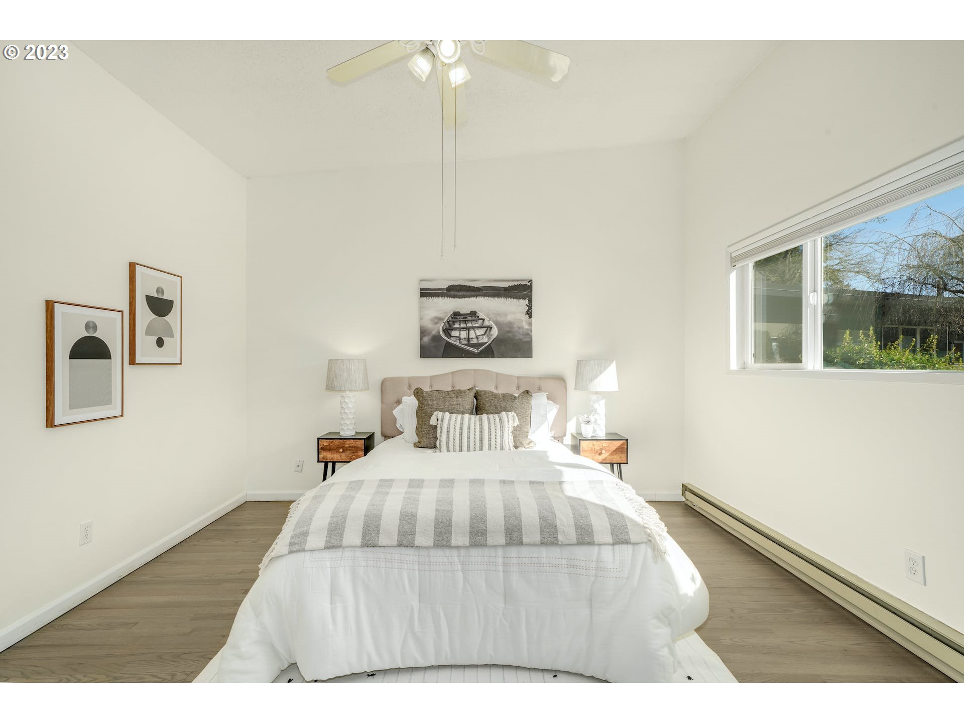 5225 Southwest Oleson Road, Unit 10 Portland, OR 97225 - Photo 16 of 30 a bedroom with a bed and a night stand