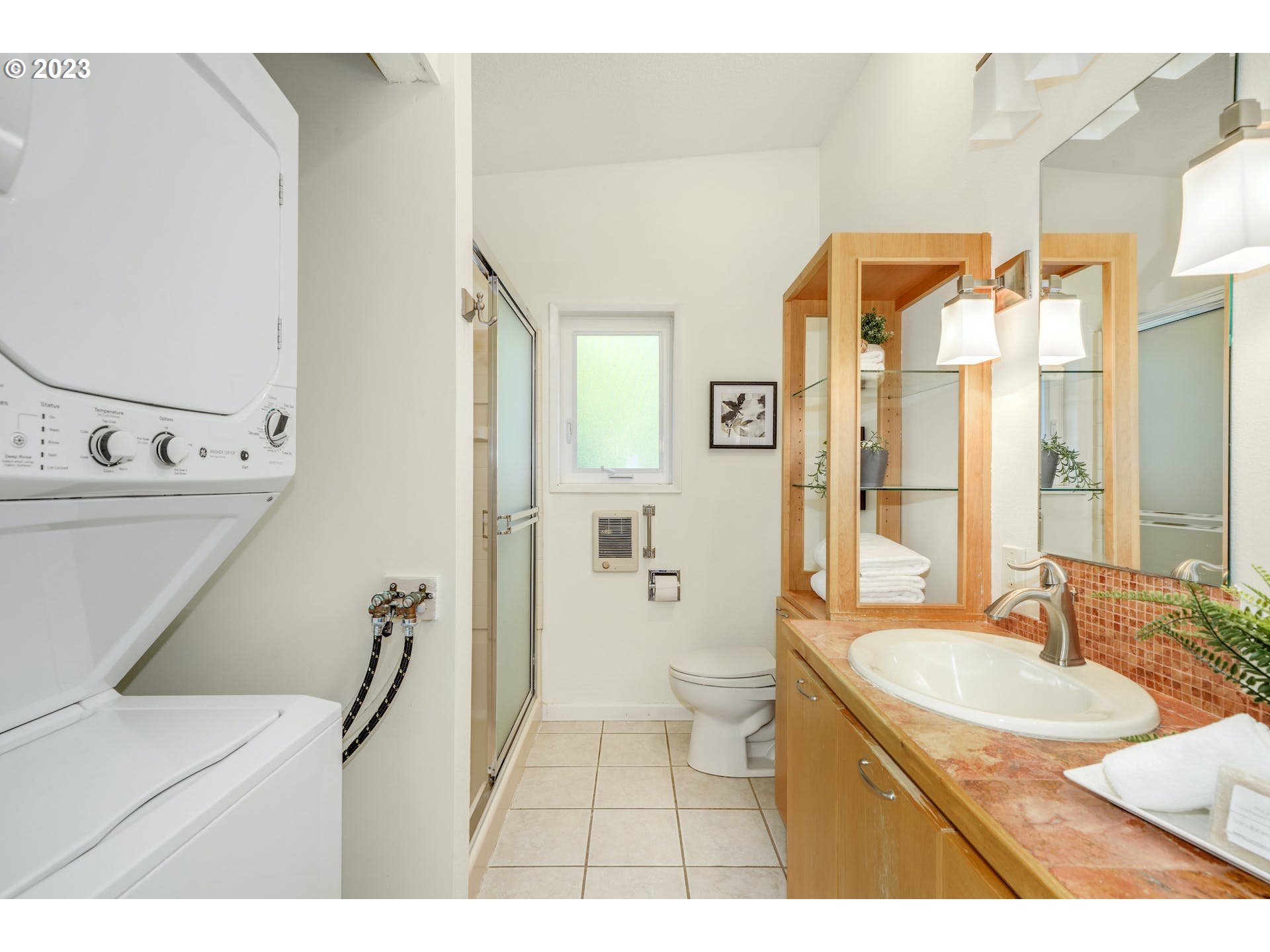 5225 Southwest Oleson Road, Unit 10 Portland, OR 97225 - Photo 19 of 30 a bathroom with a sink double vanity mirror and a toilet