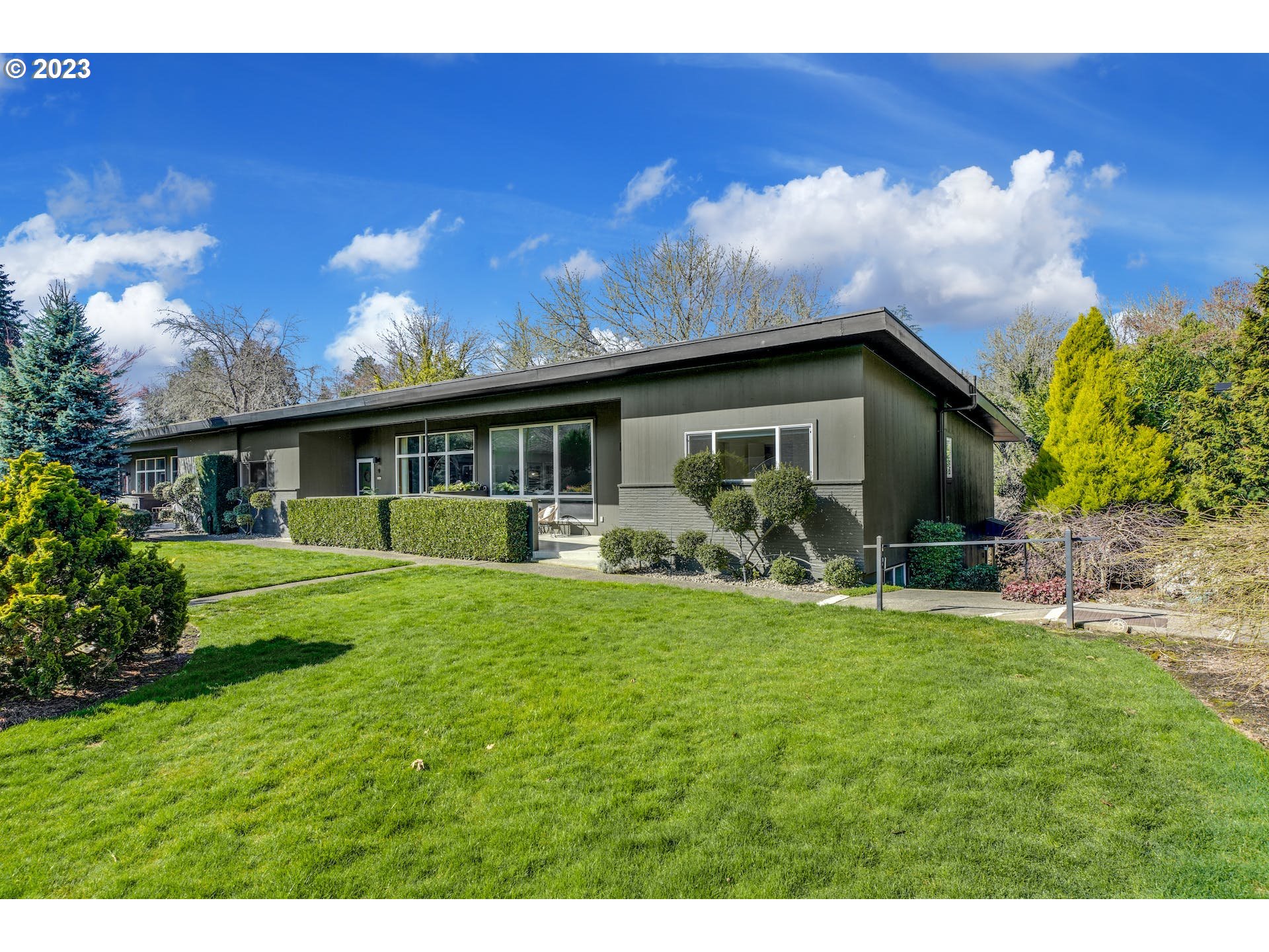 5225 Southwest Oleson Road, Unit 10 Portland, OR 97225 - Photo 2 of 30 a front view of house with a garden and patio