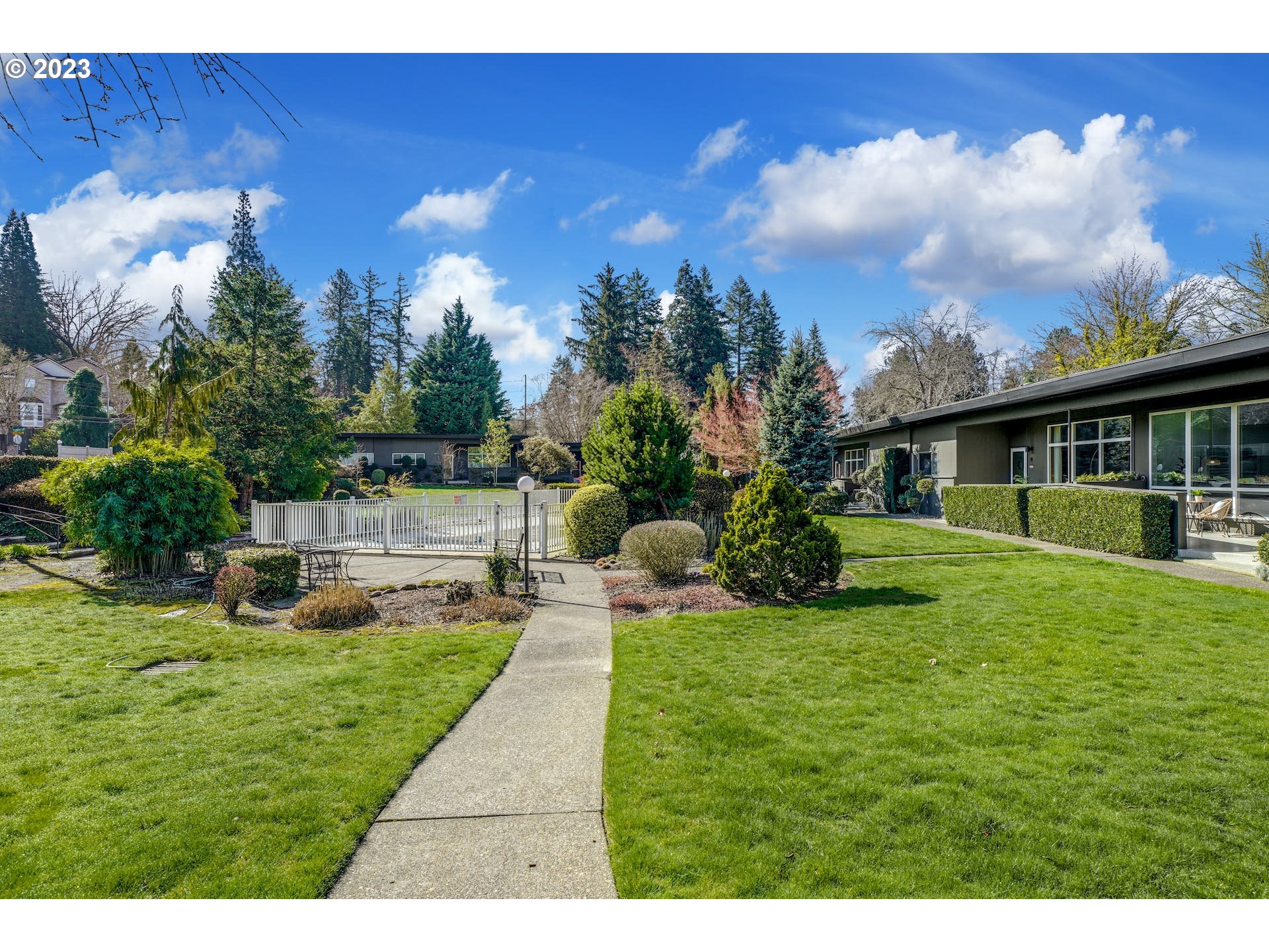 5225 Southwest Oleson Road, Unit 10 Portland, OR 97225 - Photo 25 of 30 a view of a house with backyard and sitting area