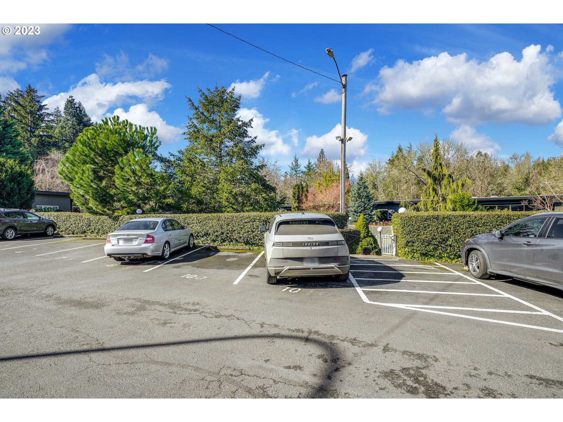 5225 Southwest Oleson Road, Unit 10 Portland, OR 97225 - Photo 28 of 30 a car parked on the side of the road