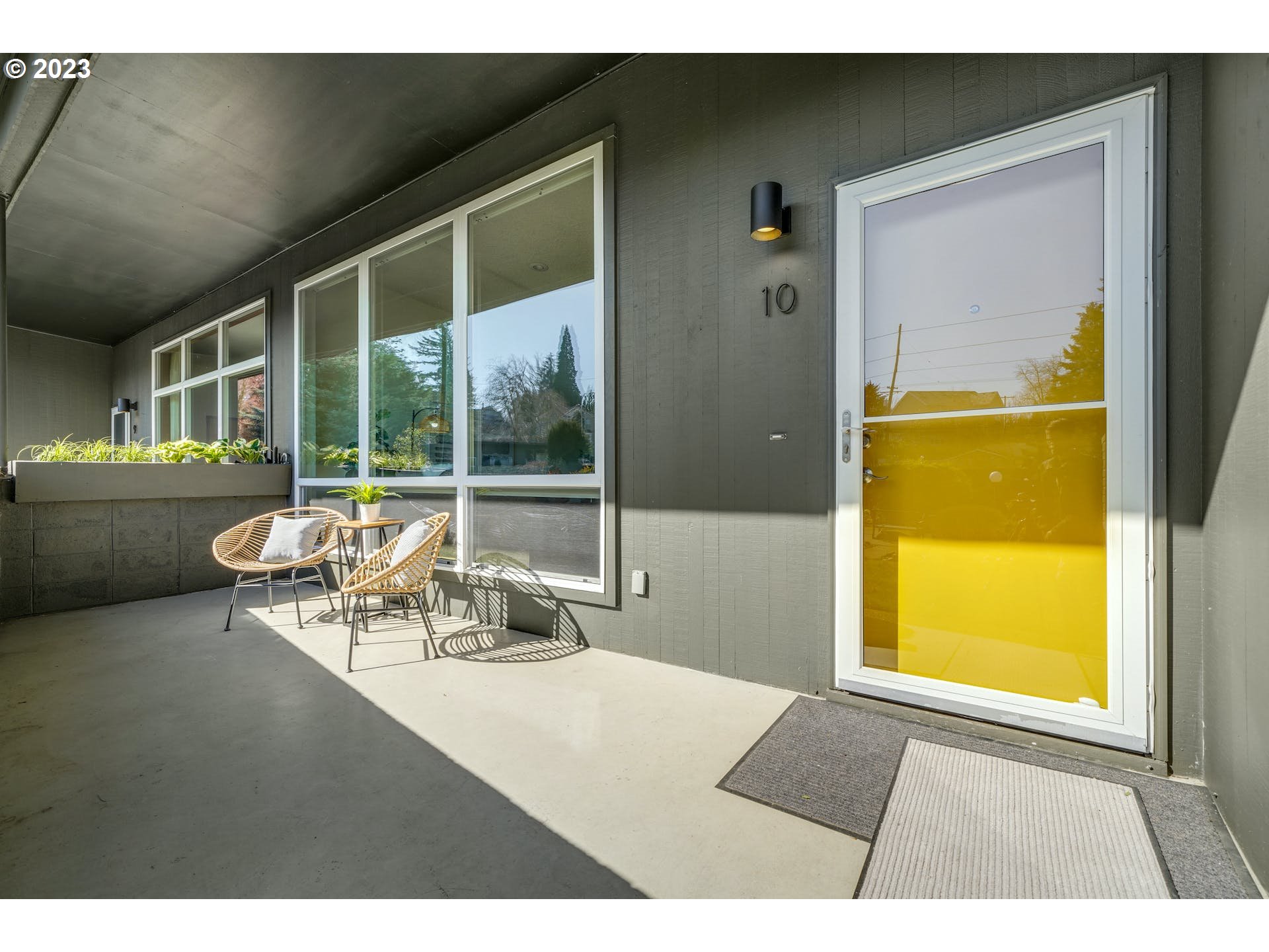 5225 Southwest Oleson Road, Unit 10 Portland, OR 97225 - Photo 3 of 30 a view of a room that has a bed and glass door