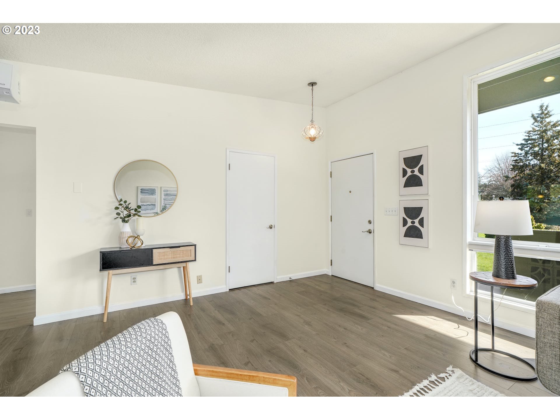 5225 Southwest Oleson Road, Unit 10 Portland, OR 97225 - Photo 7 of 30 a bedroom with a bed and a table in it