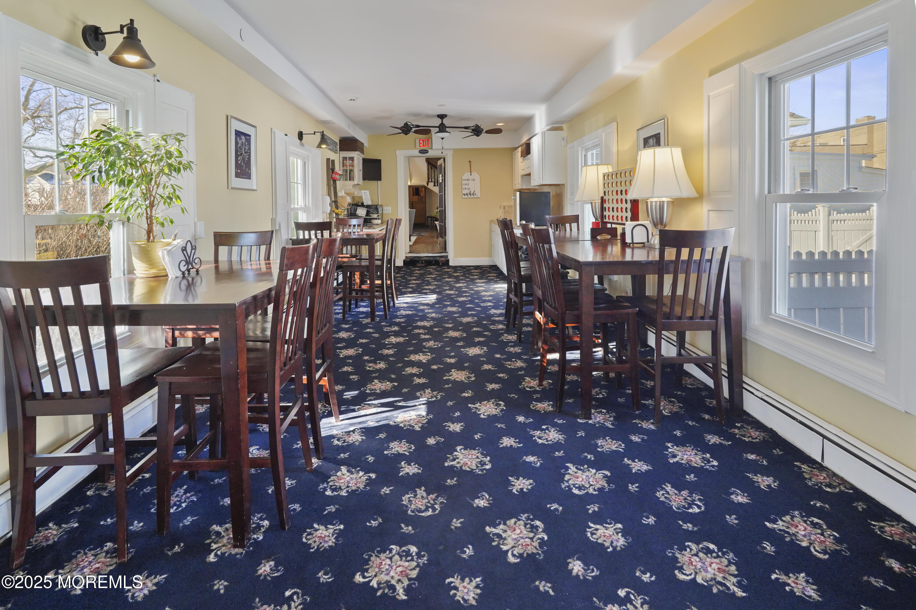200 Monmouth Avenue, Unit 21 Spring Lake, NJ 07762 - Photo 13 of 37 a view of a dining room with furniture window and wooden floor