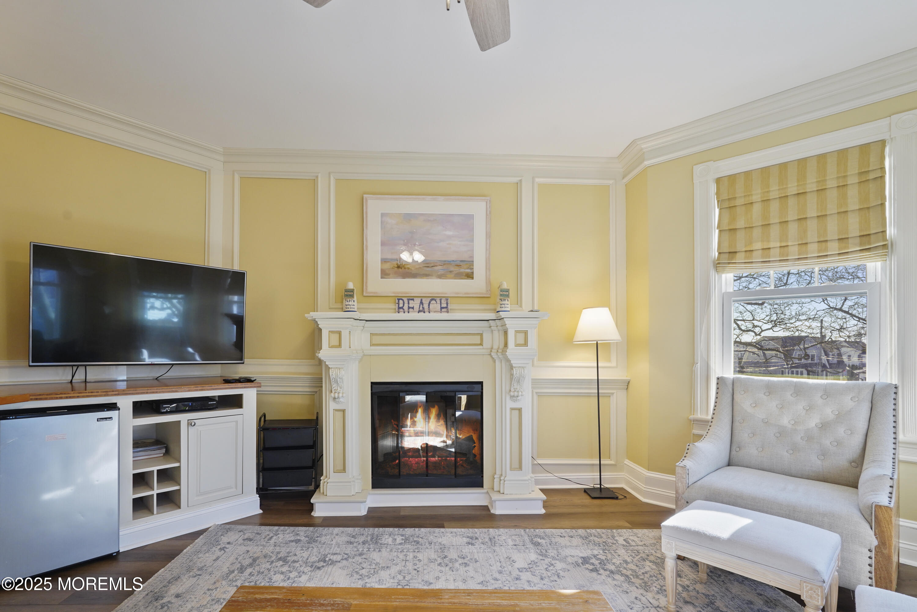 200 Monmouth Avenue, Unit 21 Spring Lake, NJ 07762 - Photo 16 of 37 a living room with furniture and a flat screen tv